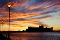 Cityscape and street lights against beautiful golden sunset Royalty Free Stock Photo