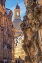 Cityscape - street view with sculptures of gatekeepers on the George Gate of Dresden Castle against the backdrop of the Dresden Fr