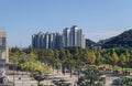 Cityscape of sunny Busan with cars mountains and apartments