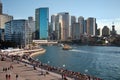 Cityscape, Sydney harbor, swarming with crowds of people and a line of skyscrapers