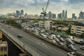 Cityscape and transportation with expressway and traffic in daytime from skyscraper of Bangkok.