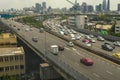 Cityscape and transportation with expressway and traffic in daytime from skyscraper of Bangkok.