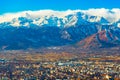 Cityscape of Turin with picturesque snowy Alps high rising on the background, Italy