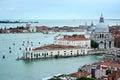 A cityscape of Venice, view of picturesque old buildings and Santa Maria della Salute Cathedral from the bell tower at Saint Mark Royalty Free Stock Photo