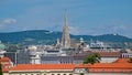 Cityscape of Vienna, with spire of the cathedral and hills in the background Royalty Free Stock Photo