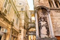 Cityscape - view of the ancient street in the city of Split with the statue of Saint Anthony on the facade of the Ciprianis Palace