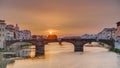Cityscape view on Arno river with famous Holy Trinity bridge timelapse on the sunset in Florence Royalty Free Stock Photo