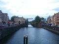 Cityscape view with canal, bridges, streets and traditional Dutch houses in Amsterdam, Netherlands Royalty Free Stock Photo