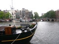 Cityscape view with canal, bridges, streets and traditional Dutch houses in Amsterdam, Netherlands Royalty Free Stock Photo