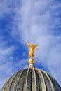 Cityscape - view of the dome of the main building of the Dresden Academy of Fine Arts with a sculpture of the goddess Pheme