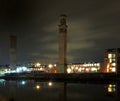 cityscape view of holbeck in south leeds showing the historic tower works at night with office building and lights reflected in Royalty Free Stock Photo