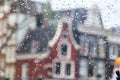 Cityscape - view on the old houses of Amsterdam in the rain through motorcycle windshield Royalty Free Stock Photo