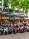 Cityscape view of old residential building and bike parking in Sanya city on Hainan island, China