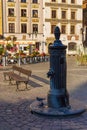 Cityscape - view of an old street standpipe is installed outdoors to dispense water in the Old Town of Warsaw Royalty Free Stock Photo