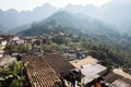 Cityscape view of Rooftops of houses and some covered in green unroasted coffee beans drying in sun