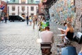 Cityscape - view of street artists who paint on the streets in the Old Town of Krakow, Lesser Poland Province, Poland