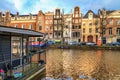 Cityscape - view of the water canal with houseboats in the historic center of Amsterdam, the Netherlands Royalty Free Stock Photo