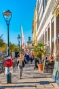 Cityscape with warm sunset over busy with tourists street near State Opera in historical downtown of Vienna, Austria at sunny day