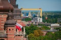 Cityscape with yellow cranes in the background