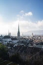 Cityscape of Zurich Switzerland with building roofs and church steeples under a cloudy blue sky Royalty Free Stock Photo