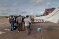 Passengers enter small Cessna 210 Centurion airplane