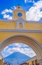 Ciudad de Guatemala, Guatemala, April, 25, 2018: The famous arch of the city center of Antigua together with agua Royalty Free Stock Photo