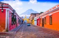Ciudad de Guatemala, Guatemala, April, 25, 2018: Cityscape in the main street of Antigua city with the Agua volcano in