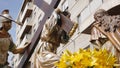 CIUDAD REAL, SPAIN - APRIL 14, 2017: Passing of sculptures of Jesus carrying cross and roman soldier with a spear during day proce