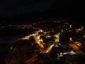 Civetta city night drone view. Fireworks in new year in dolomites . Aerial view of the city at night. Long exposure photo.