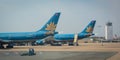 Civil airplanes docking at Tan Son Nhat airport in Saigon, Vietnam Royalty Free Stock Photo