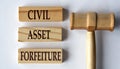 CIVIL ASSET FORFEITURE - words on wooden blocks on a white background with a judge\'s gavel Royalty Free Stock Photo