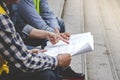 Civil Construction engineer teams shaking hands together wear work helmets worker on construction site. Foreman industry project Royalty Free Stock Photo