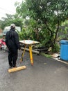 An civil engineer doing Plane Table survey at construction site.