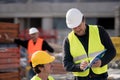 Civil engineer giving instructions to construction worker