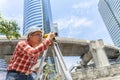 Civil engineer land survey with tacheometer or theodolite equipment. Worker Checking construction site on the road. Surveyor Royalty Free Stock Photo