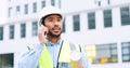 Civil engineer on a phone call while at a construction site discussing a strategy and plan to work on. Close up portrait Royalty Free Stock Photo