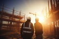 A civil engineer with safety equipment stands looking at the construction site. Generative AI. Royalty Free Stock Photo