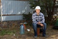 Civil Engineer Sitting at Construction Site Corner Royalty Free Stock Photo