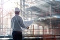 Civil engineer standing at building construction while hold blueprint. AIG42.