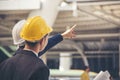 Civil engineer teams meeting working together wear worker helmets hardhat on construction site in modern city. Foreman industry Royalty Free Stock Photo