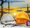 Civil engineer working table with safety helmet and writing inst Royalty Free Stock Photo