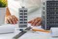 Civil engineering housing development - house scale models and blueprints on the desk