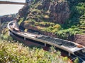 Civil engineering project showing rock shed construction using large quantities of vehicle tyres to form a cushion layer Royalty Free Stock Photo