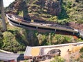 Civil engineering project showing rock shed construction using large quantities of vehicle tyres to form a cushion layer Royalty Free Stock Photo