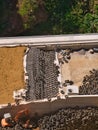 Civil engineering project showing rock shed construction using large quantities of vehicle tyres to form a cushion layer Royalty Free Stock Photo