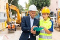 Civil engineers checking work process in construction site Royalty Free Stock Photo