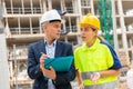 Civil engineers checking work process in construction site Royalty Free Stock Photo