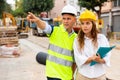 Civil engineers checking work process in construction site Royalty Free Stock Photo