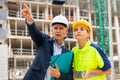 Civil engineers checking work process in construction site Royalty Free Stock Photo