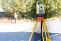 Civil Engineers At Construction Site using an altometer Surveyor equipment tacheometer outdoors